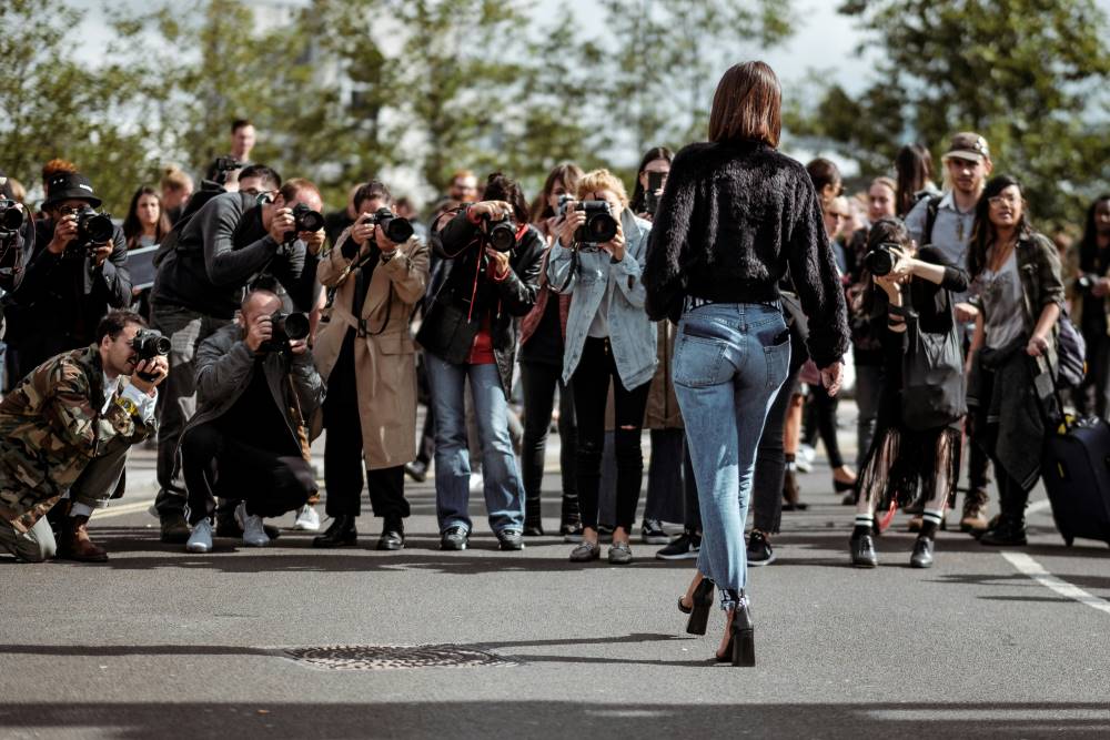 A model gets the photographers excited at London Fashion Week 2017