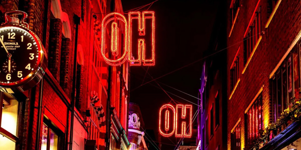 The Soho street lights lit up at night in red