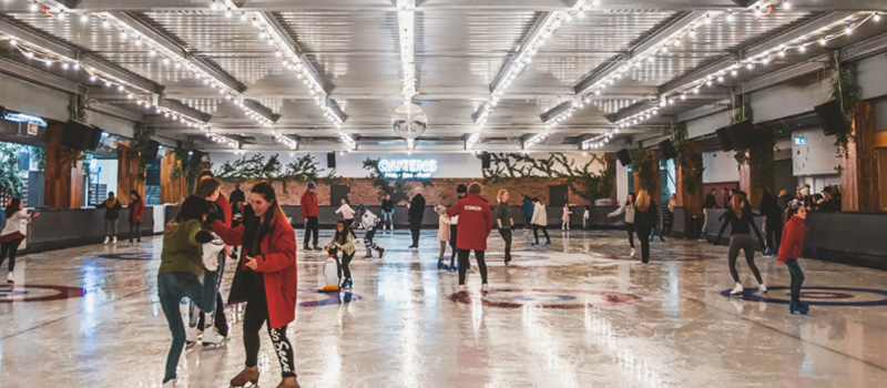 Queens skate rink in the evening with happy customers on dates